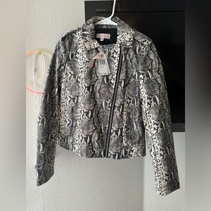 Jacket size S is new with stamp of animal print